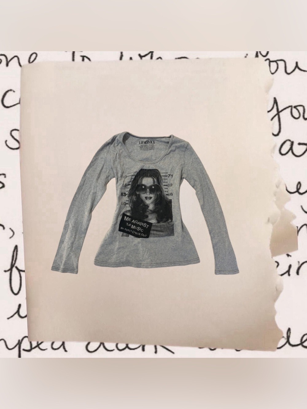 lip service long sleeve mugshot kiss graphic top ‘me against the music’